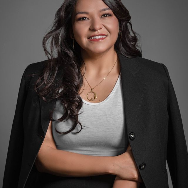 Smiling professional in a dark blazer